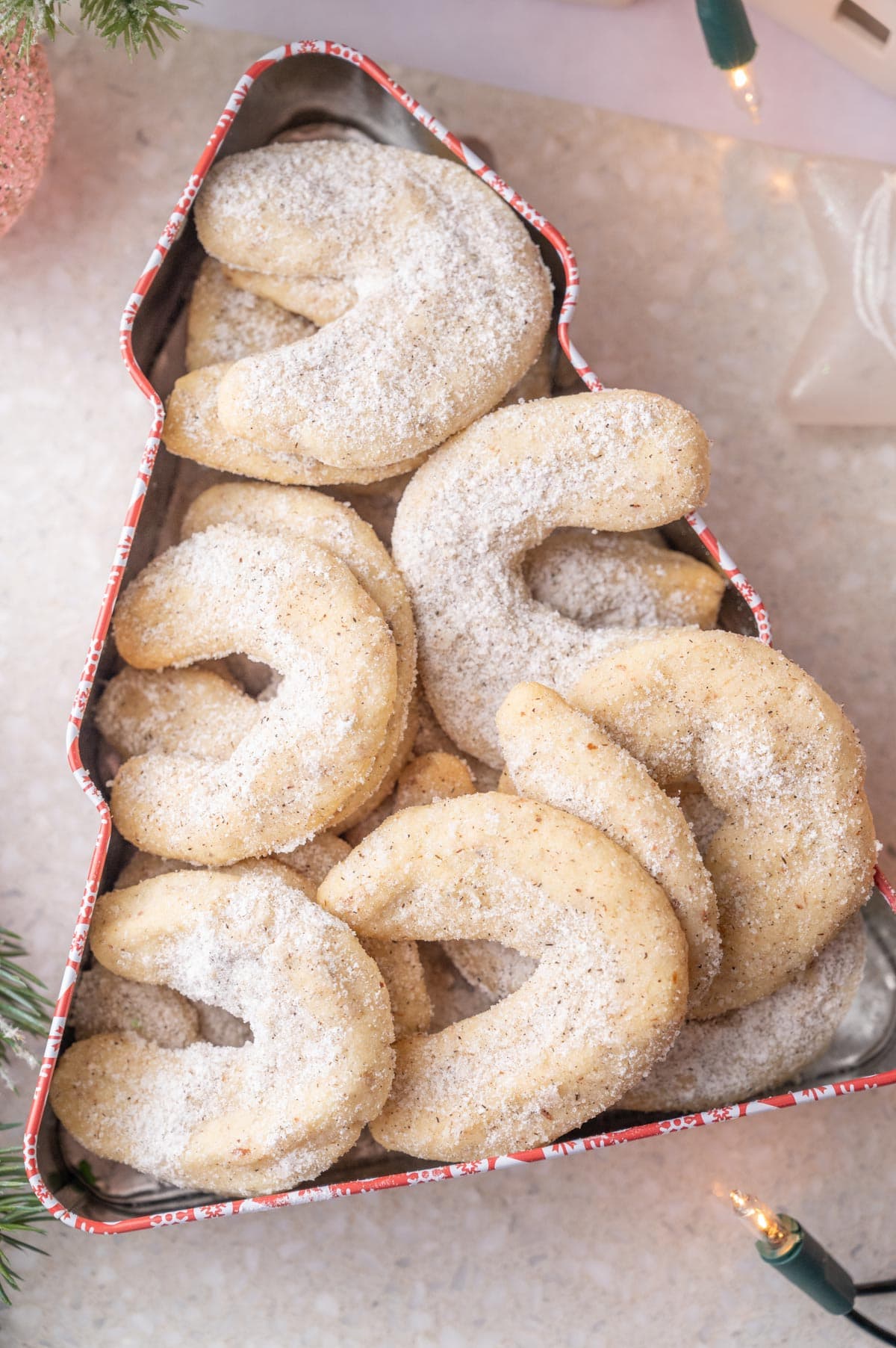 Vanillekipferl cookies in a cookie tin.